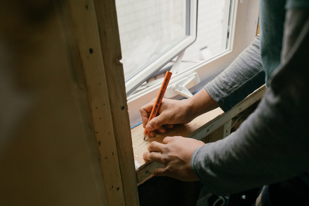 construction, measuring, pencil in hand, window frame, wood framing