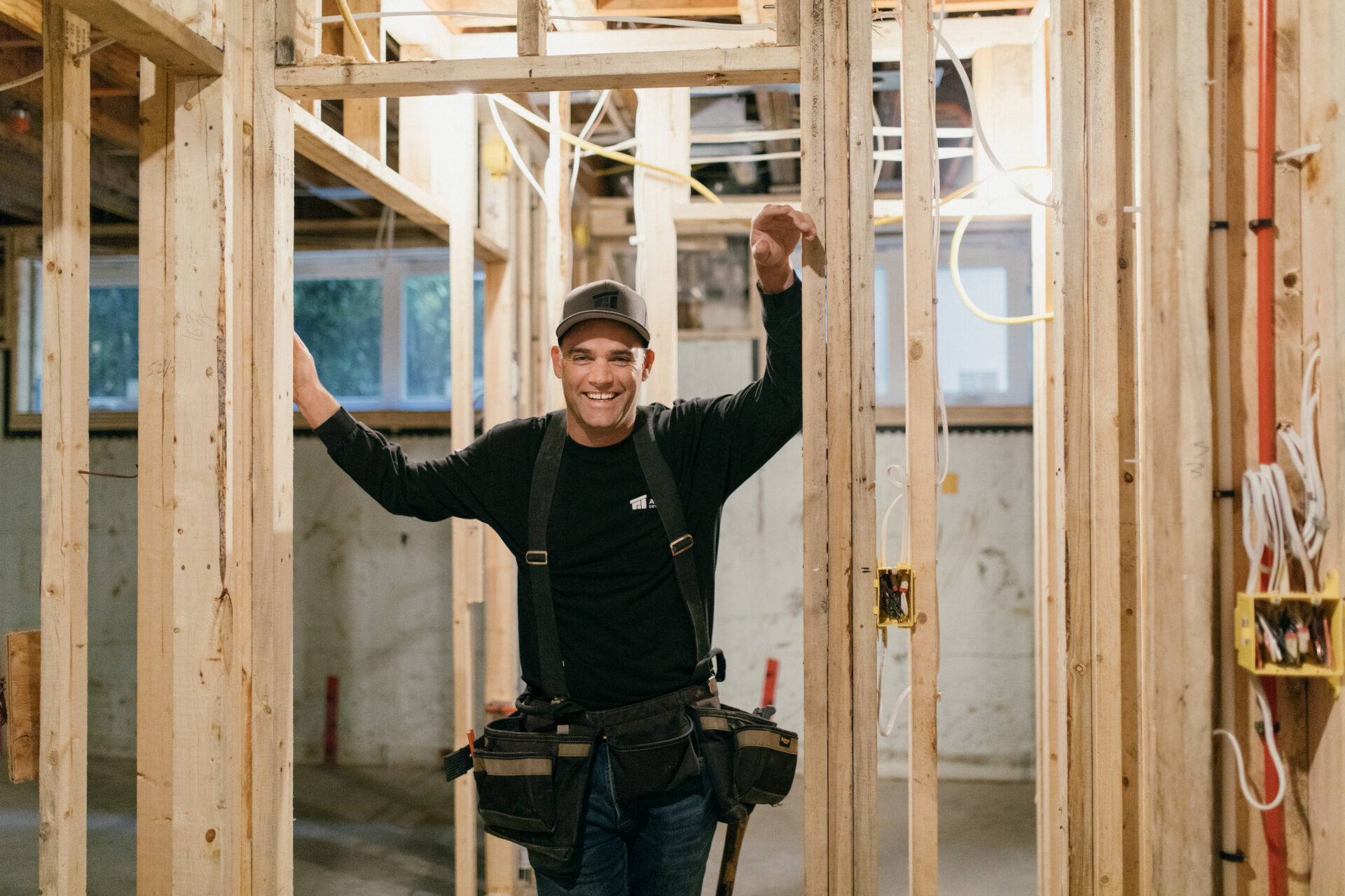 Guy Taylor, in progress construction site, wood framing, tool belt, Averra construction site, rough in electrical