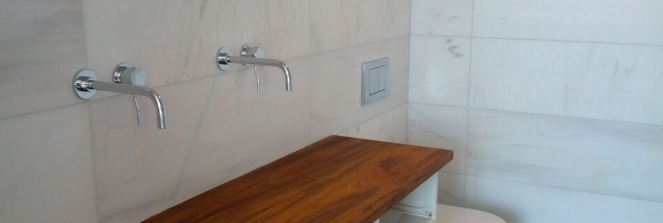 teak, teak counter, wall mount facets, two facets, wall mounted toilet, white toilet, large tiles