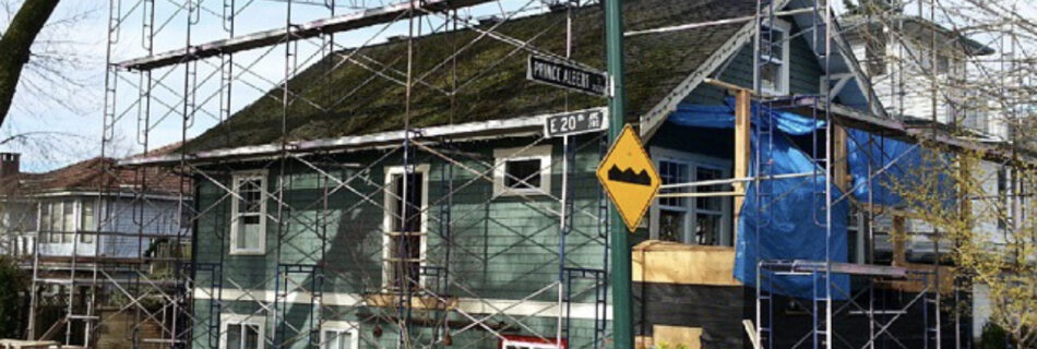 green traditional house, scaffolding, preparing for renovation, street view, construction